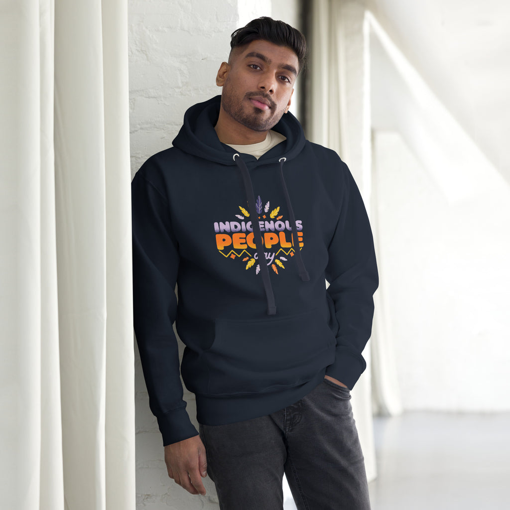 Male model leaning against a wall in a navy blue Hoodie