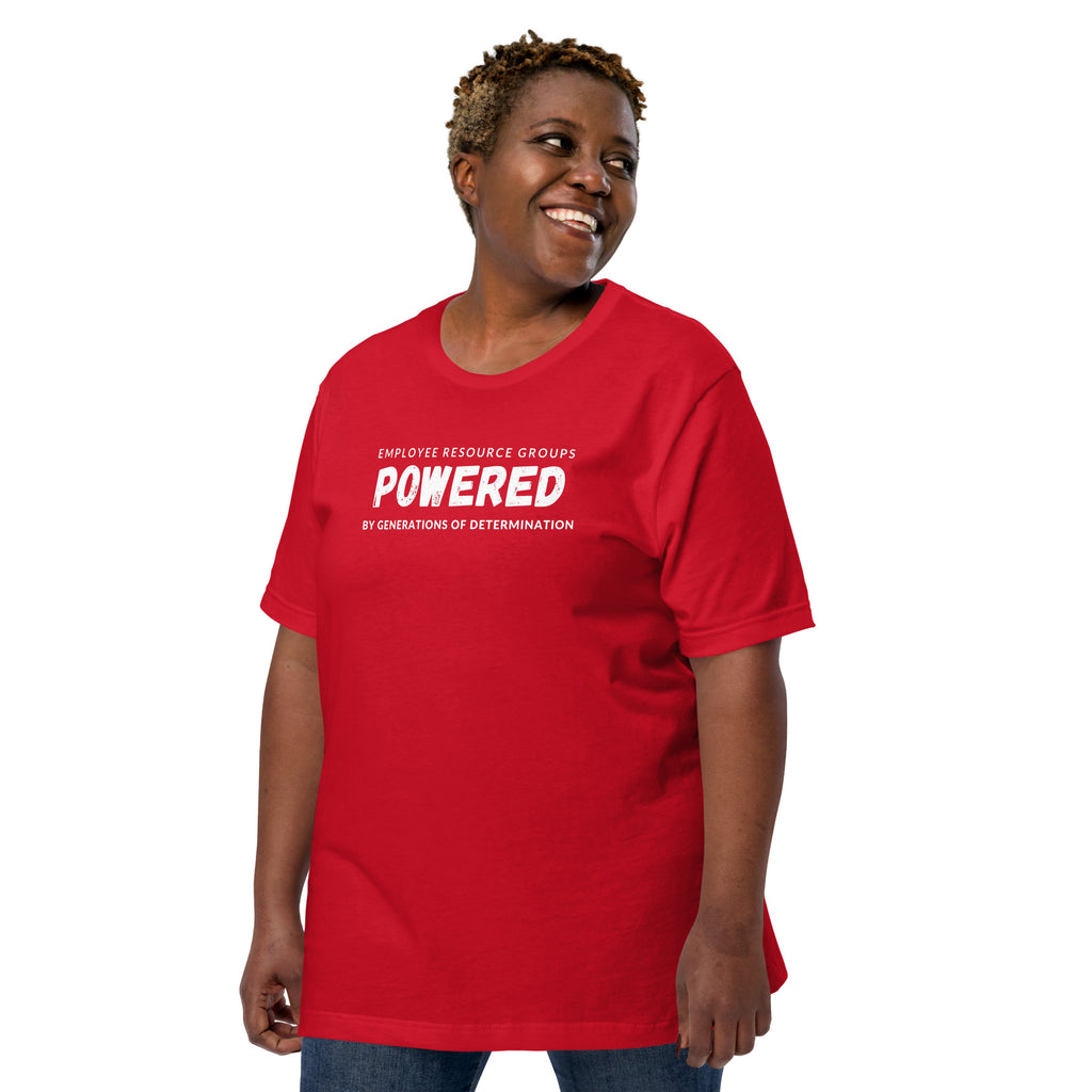 Larger sized woman smiling and posing in a red t-shir with the words Employee Resource Groups Powered by Generations of Determination written across the front