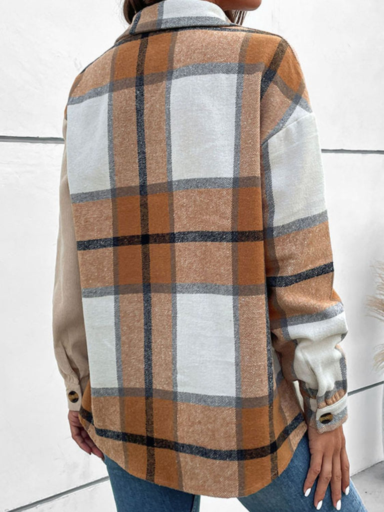 Back of tan collard shirt. Larger plaid print from top to bottom and one side of sleeve.  Worn by a female model in blue jeans